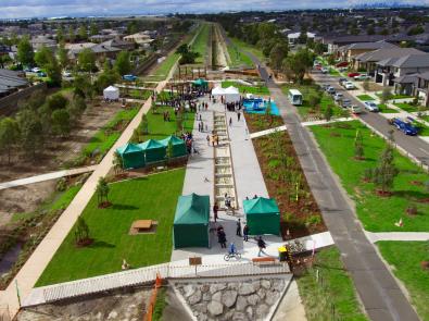 Image shows the transformation of the pipeline into a community park where the open area is covered in grassland and plantings