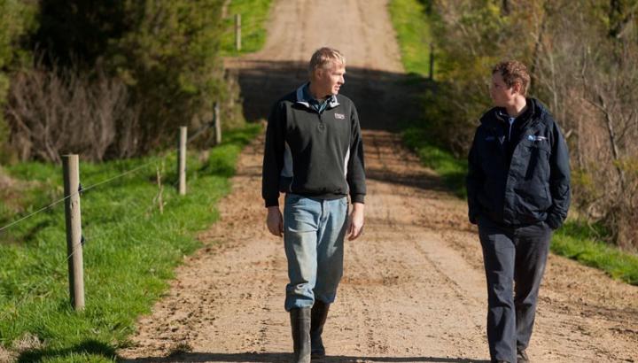 Farmer and MW staff walking along country road