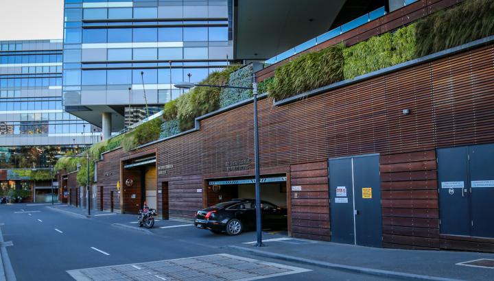 city building with green walls provide shade and insulation