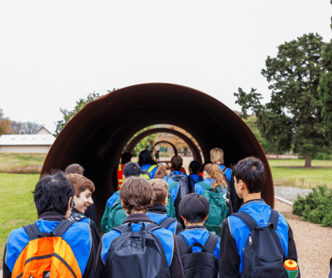 School group of students walking through series of tunnels at WTP