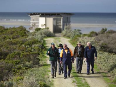 Birdwatchers at the Western Treatment Plant bird hide Group of birdwatchers walking from the Western Treatment Plant bird hide