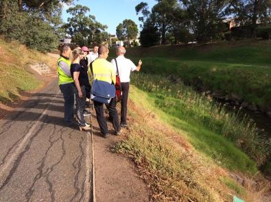 Members of the Chain of Ponds working group walk along Moonee Ponds Creek
