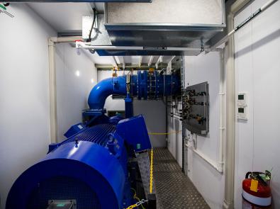Mini-hydro electricity plant - Dandenong Blue generator inside a mini-hydroelectricity plant