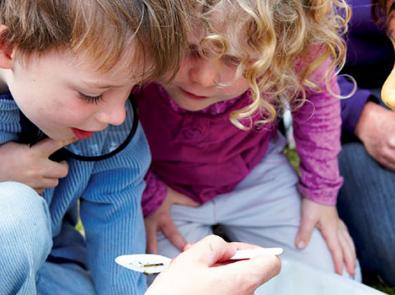 Three children inspecting waterbugs, City of Greater Dandenong