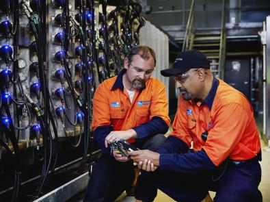 Two people working together at a Melbourne Water facility