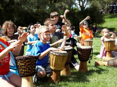 Kids playing drums at Waterwatch Family Festival