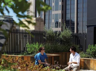 rooftop-garden-queenst-1200 Two people enjoying rooftop garden at 131 Queen St, Melbourne