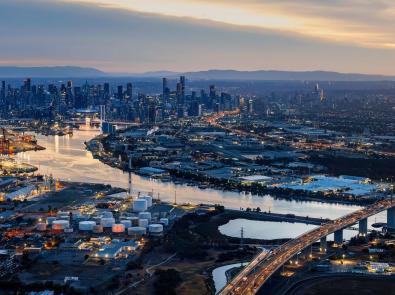 Aerial view at dusk of Fisherman's Bend towards the city of Melbourne