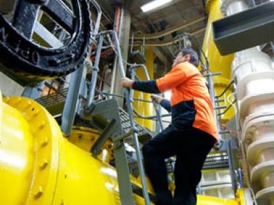 Pumping station interior showing an employee at work