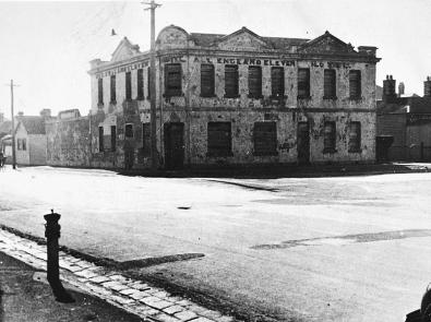 Black and white photo of two-storey hotel