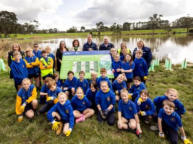 Water Minister Harriet Shing with the kids from The Basin Primary School at Liverpool Road Retarding Basin