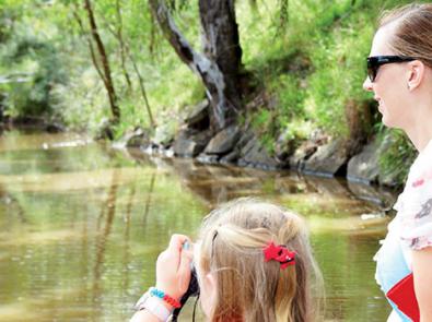 Mother and child looking out at their local waterway