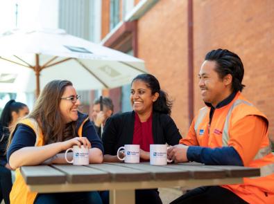 three employees having coffee