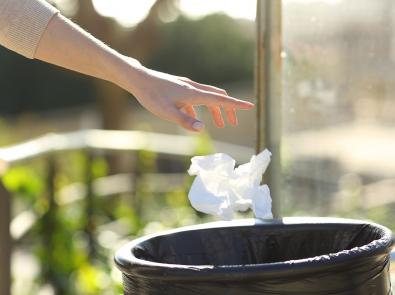 Waterway litter and amenity - binning litter Litter being placed into outdoor bin
