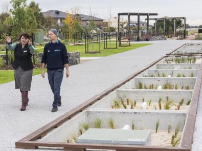 woman and man walking along open space