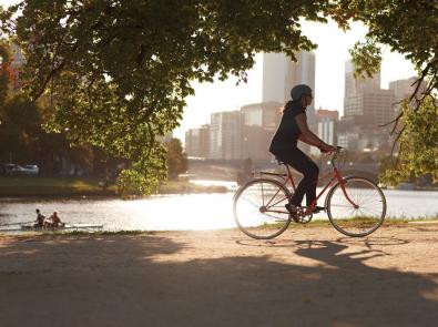 woman cycling along Yarra River