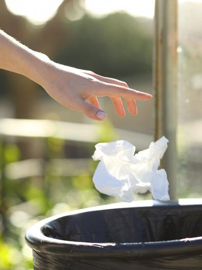 Waterway litter and amenity - binning litter Litter being placed into outdoor bin