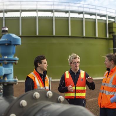 Melbourne Water workers conversing on site