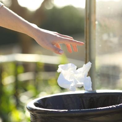 Litter being placed into outdoor bin