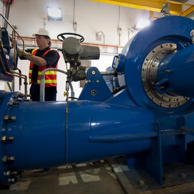 Technician in mini-hydro control room