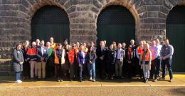 Melbourne Water staff and Victorian Government representatives, embassy officials, guests from Singapore’s National Water Authority, and a number of metropolitan water retailers and water sector peers standing together at Western Treatment Plant