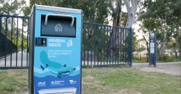 Solar-powered rubbish bin decorated with a platypus image, in a park along Diamond Creek.