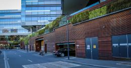 city building with green walls provide shade and insulation