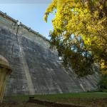 Base of Maroondah Dam with valve house and tree