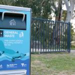 Solar-powered rubbish bin decorated with a platypus image, in a park along Diamond Creek.