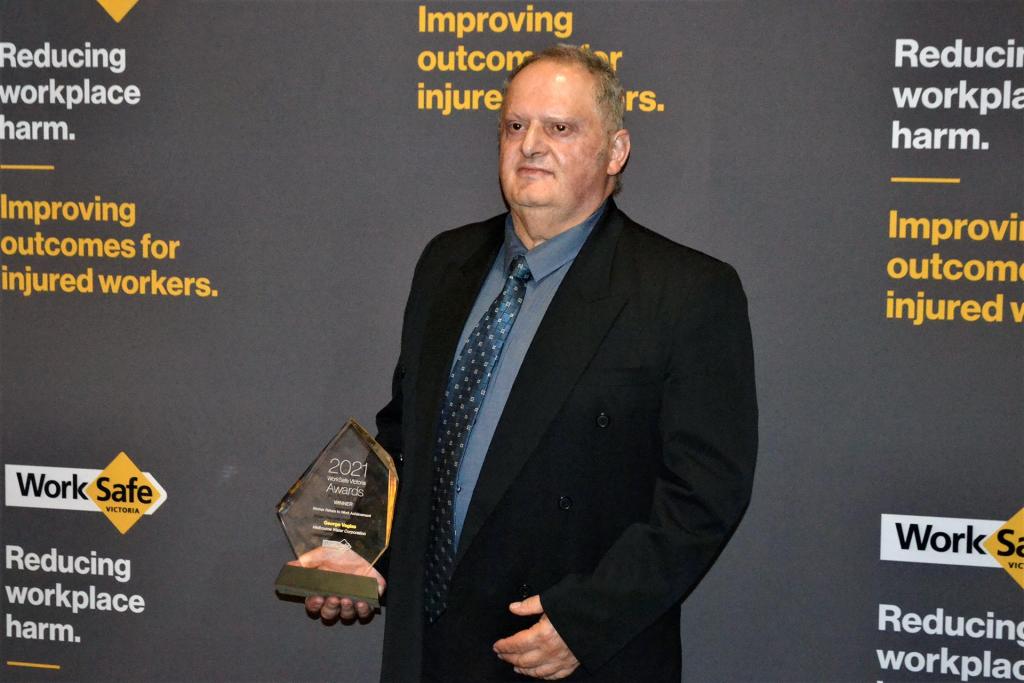 Melbourne Water employee George Vagias holding his WorkSafe Victoria 2021 award.