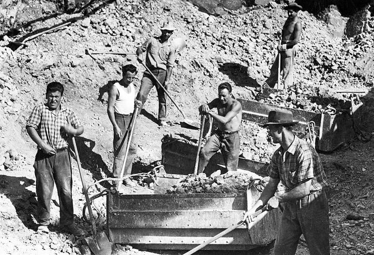 Black and white photograph of workers with picks and shovels