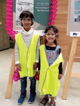 Two children in front of a sign at the Western Treatment Plant