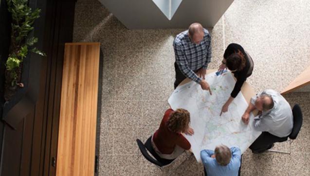 Overhead view of Melbourne Water employees seated around table