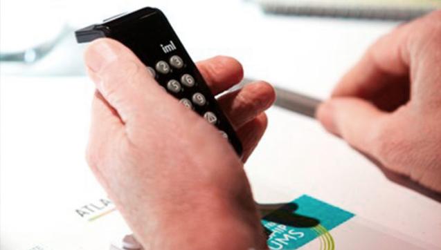 Close up of person using calculator