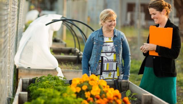 CEO of Hope City Mission community garden with Melbourne Water staff member