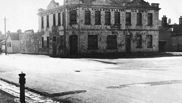 Black and white photo of two-storey hotel