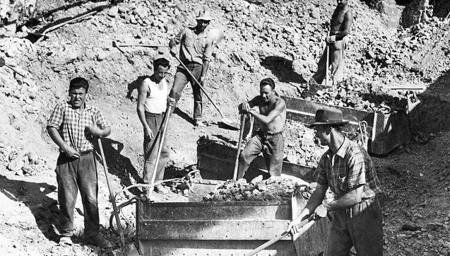 Black and white photograph of workers with picks and shovels
