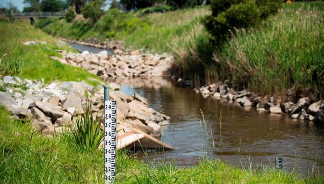 River with flood gauge in foreground